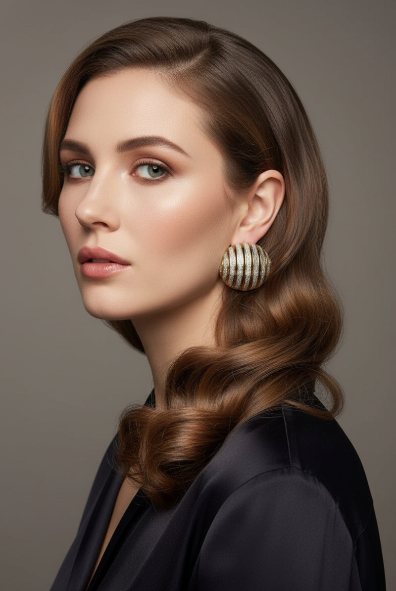 Professional model showcasing large ribbed dôme earrings with a two-tone textured finish, elegant mixed metal jewelry for high-end corporate or evening wear.