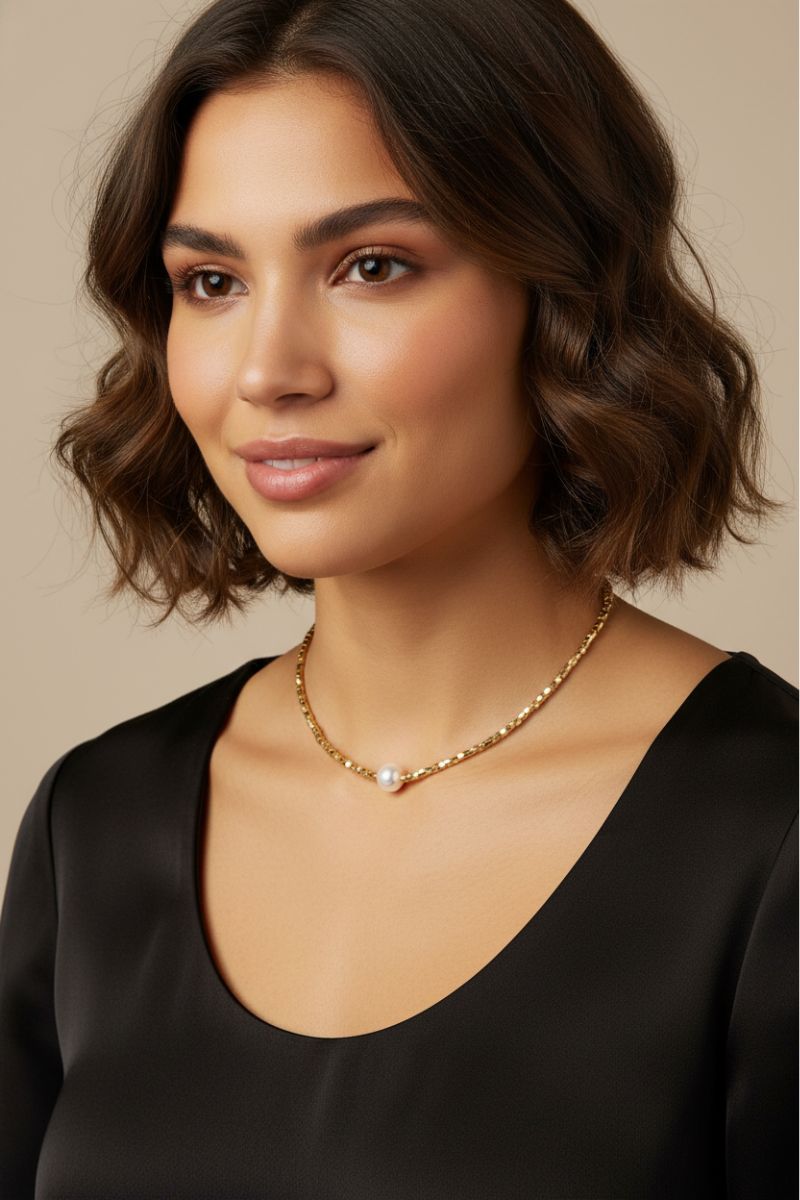 Office lady wearing 18K gold plated cubic bead with a central pearl necklace.