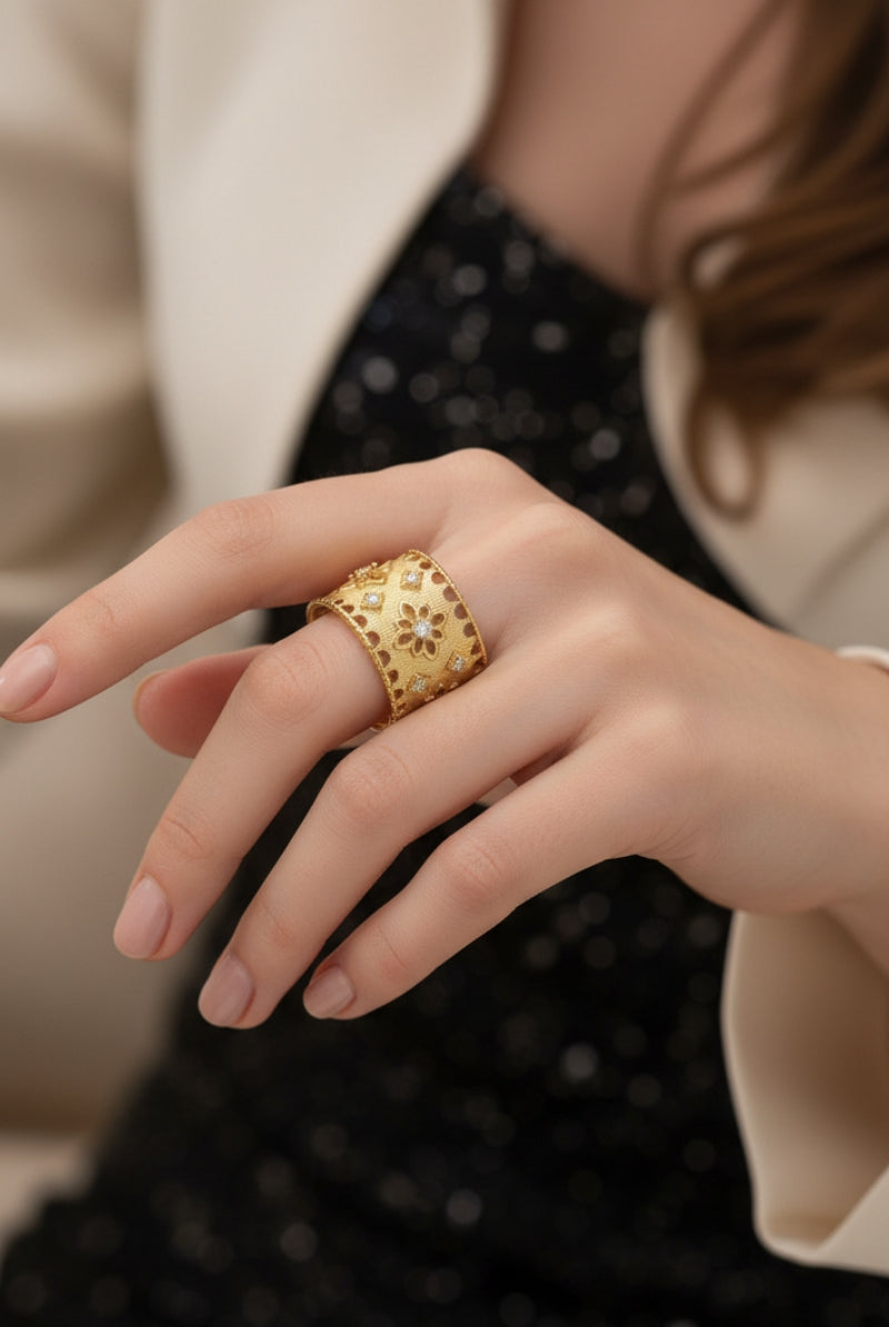 A close-up portrait of a hand with a textured gold ring, layered over a sparkling black dress, ideal for an upscale Chicago evening event or cocktail party.