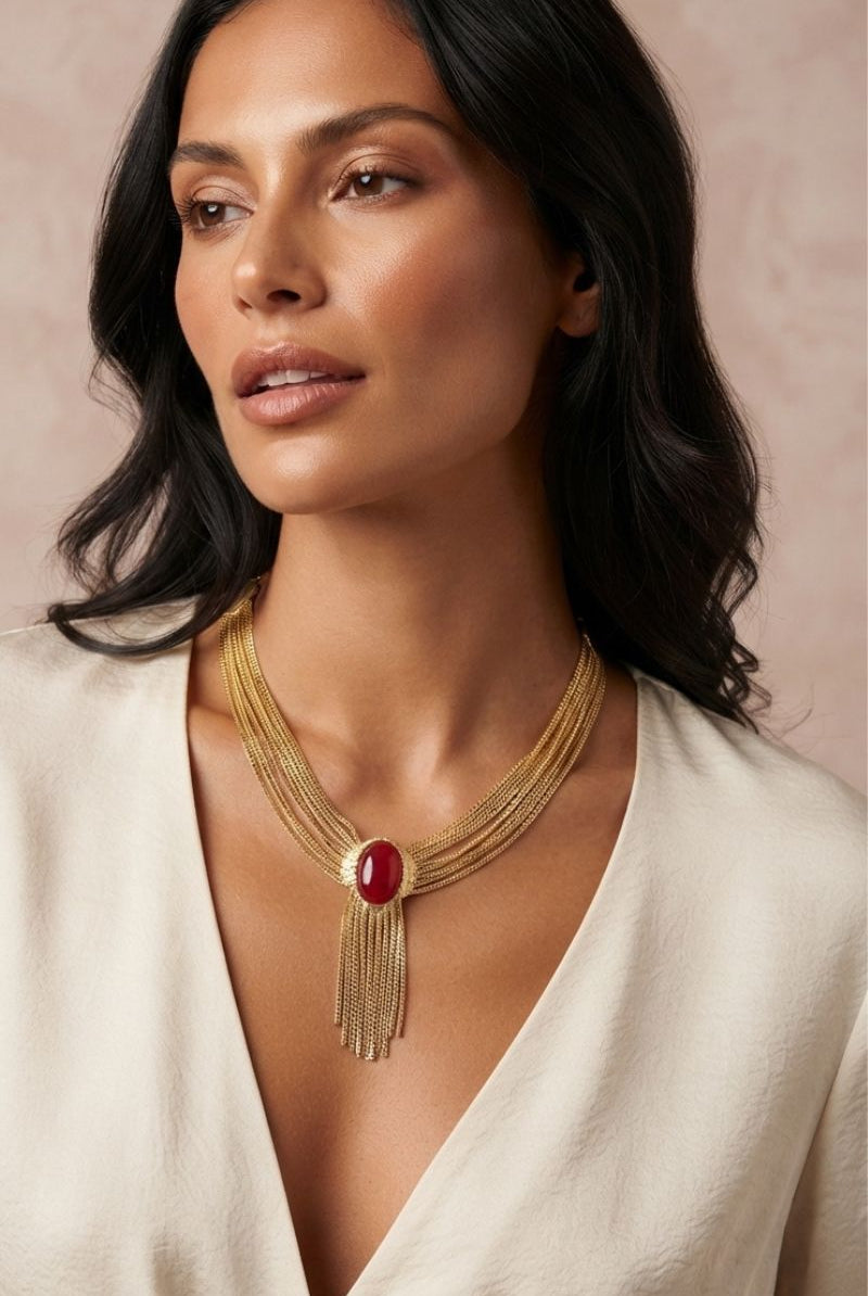 Eclipse red crystal statement necklace styled with a white V-neck blouse