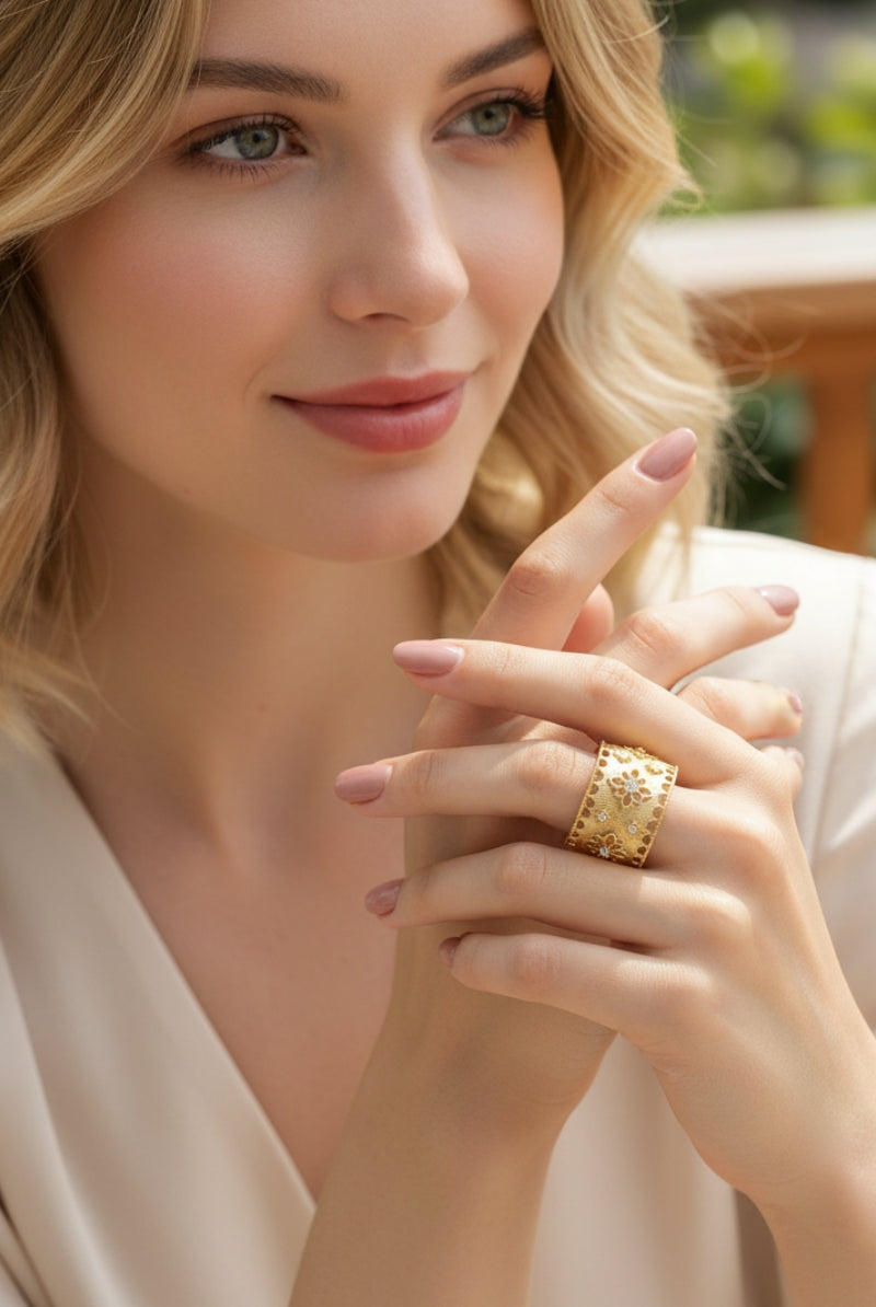 Portrait of a smiling model with blonde hair wearing the wide Ash gold band ring, perfect for an elegant Manhattan street style aesthetic.