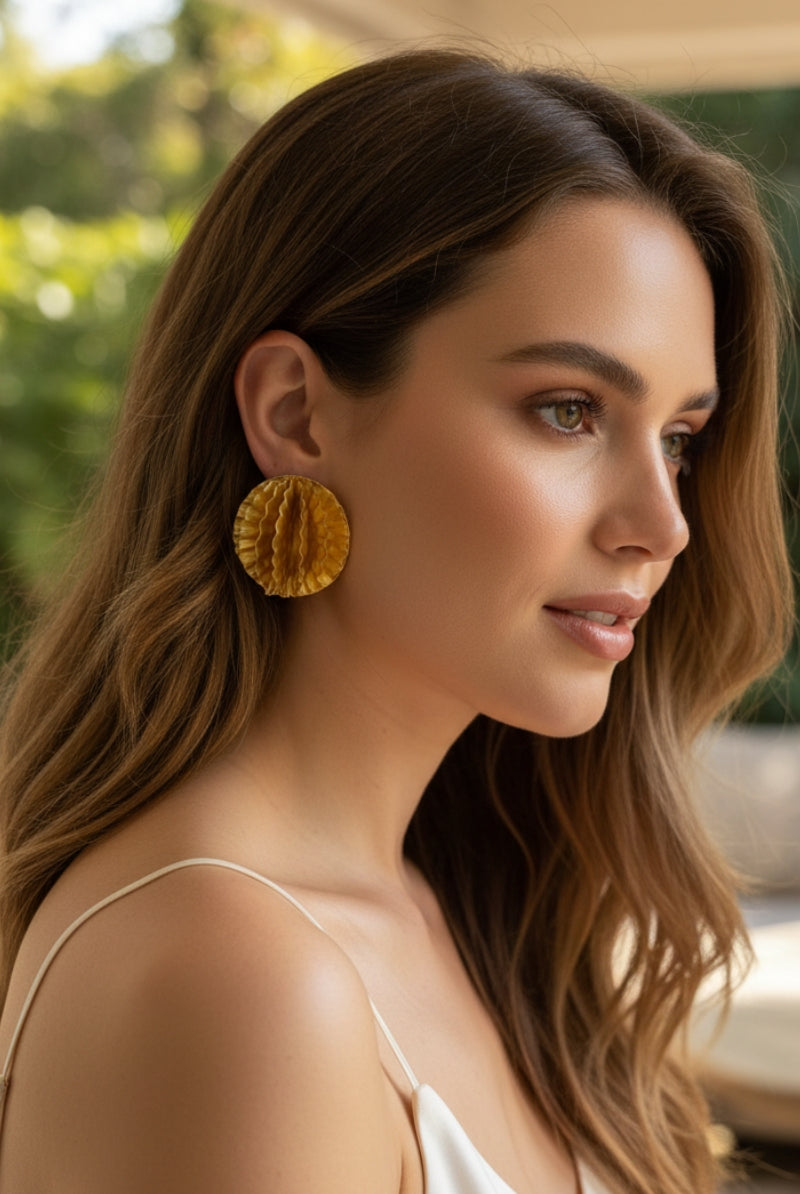 Side view of Aurelia 3D honeycomb gold disc earrings, lightweight summer vacation statement jewelry for Mediterranean or California style.