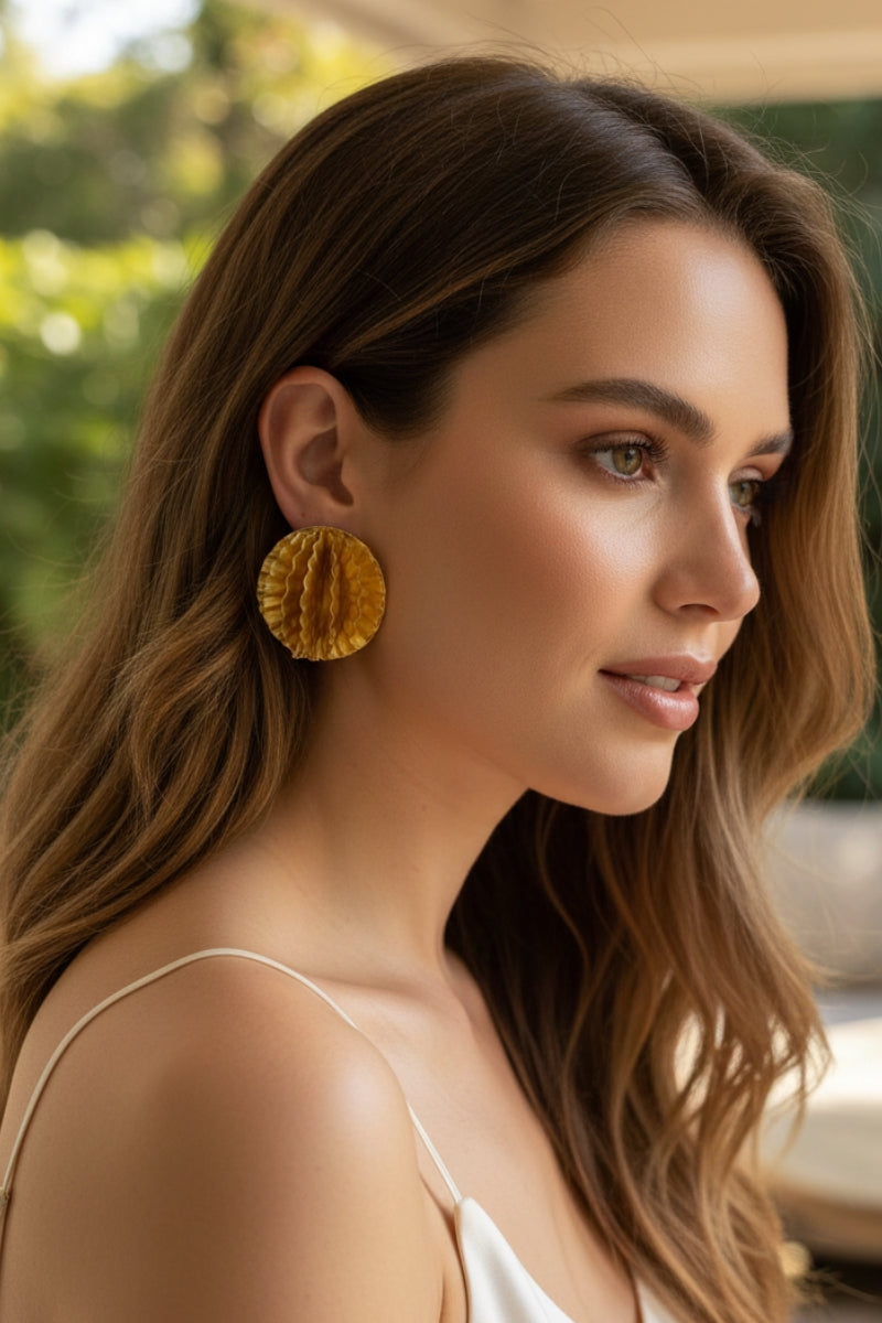 Side view of Aurelia 3D honeycomb gold disc earrings, lightweight summer vacation statement jewelry for Mediterranean or California style.