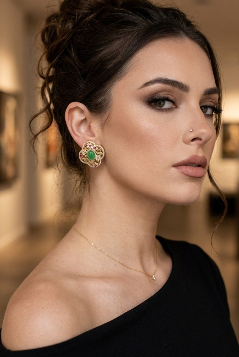 Model wearing green crystal quatrefoil stud earrings, view 3
