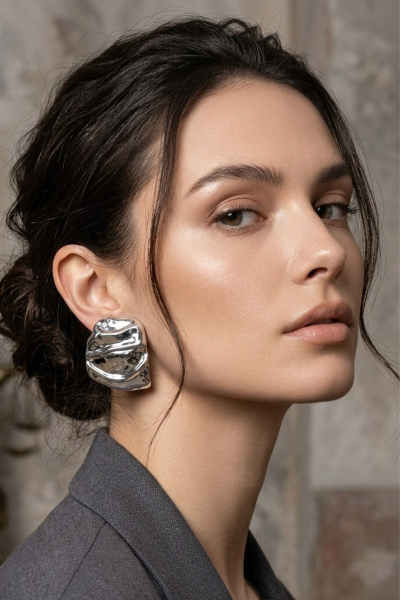 Model wearing liquid silver square statement stud earrings, view 5