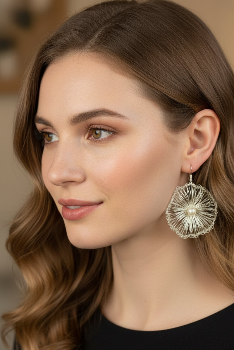 Modern woman in a black turtleneck featuring All Glows gold hand-crocheted filigree drops, perfect for a refined Soho NYC street style aesthetic.