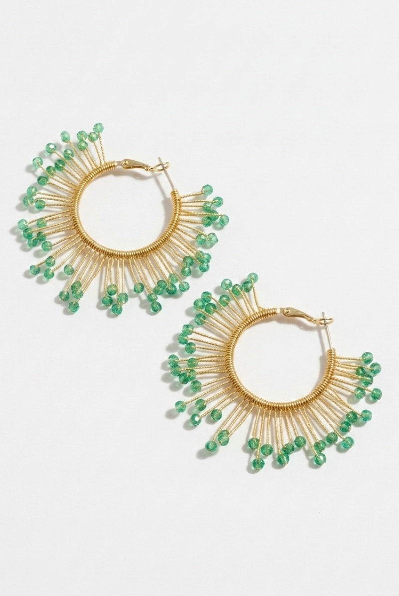 Pair of solburst wire-wrapped beaded sunburst hoop earrings in the Seafoam variant on a white background
