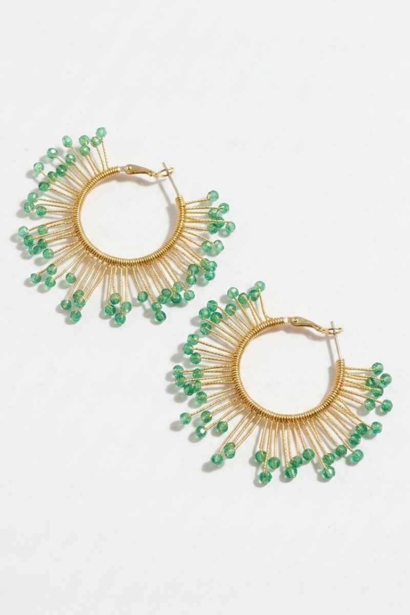 Pair of solburst wire-wrapped beaded sunburst hoop earrings in the Seafoam variant on a white background