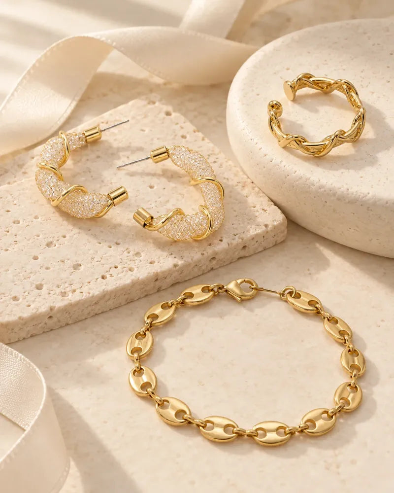 Gold earrings, ring and bracelet from the All-Glows Gifts Under $50 edit
