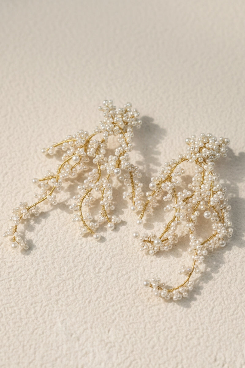 All Glows 18K gold plated earrings with shell pearls, showcasing a contemporary baroque aesthetic.