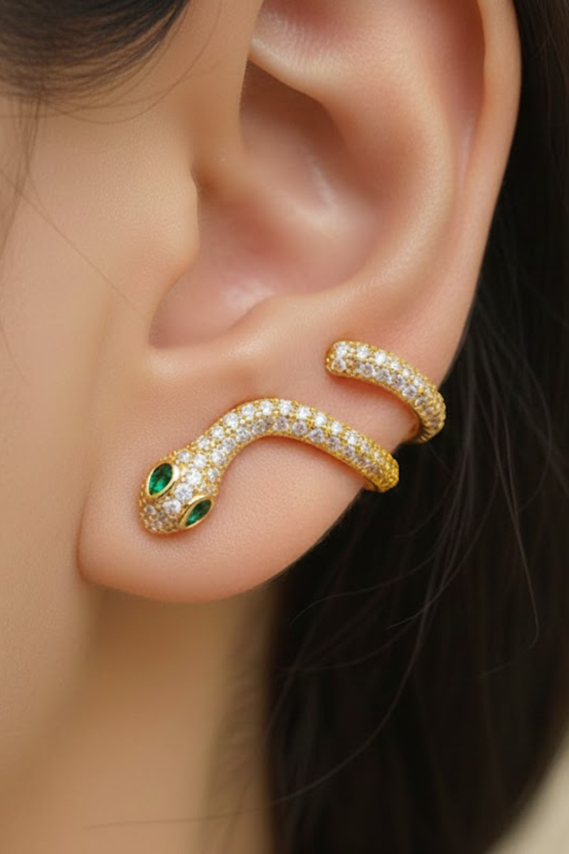 Eden Snake Earring in 18K Gold Plated with Emerald Green Eyes and Sparkling Zirconia on Female Model.