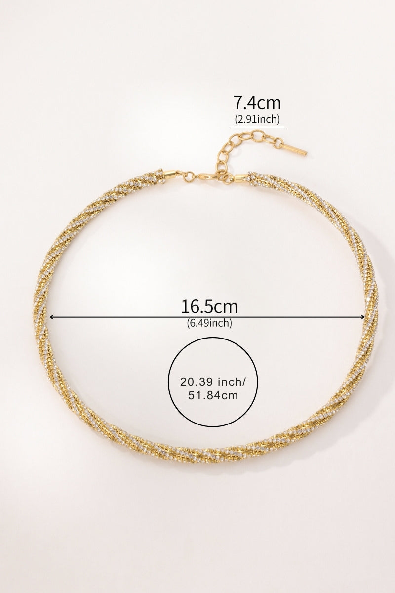 A gold-toned beaded choker necklace is shown on a plain light background with overlaid dimension labels indicating a width of 16.5 cm and an extender length of 7.