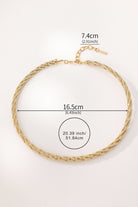 A gold-toned beaded choker necklace is shown on a plain light background with overlaid dimension labels indicating a width of 16.5 cm and an extender length of 7.