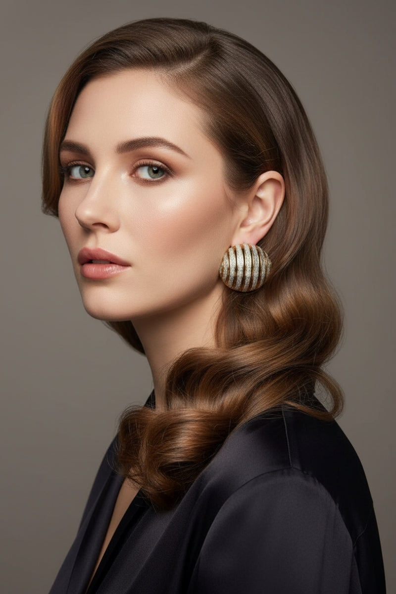 Professional model showcasing large ribbed dôme earrings with a two-tone textured finish, elegant mixed metal jewelry for high-end corporate or evening wear.