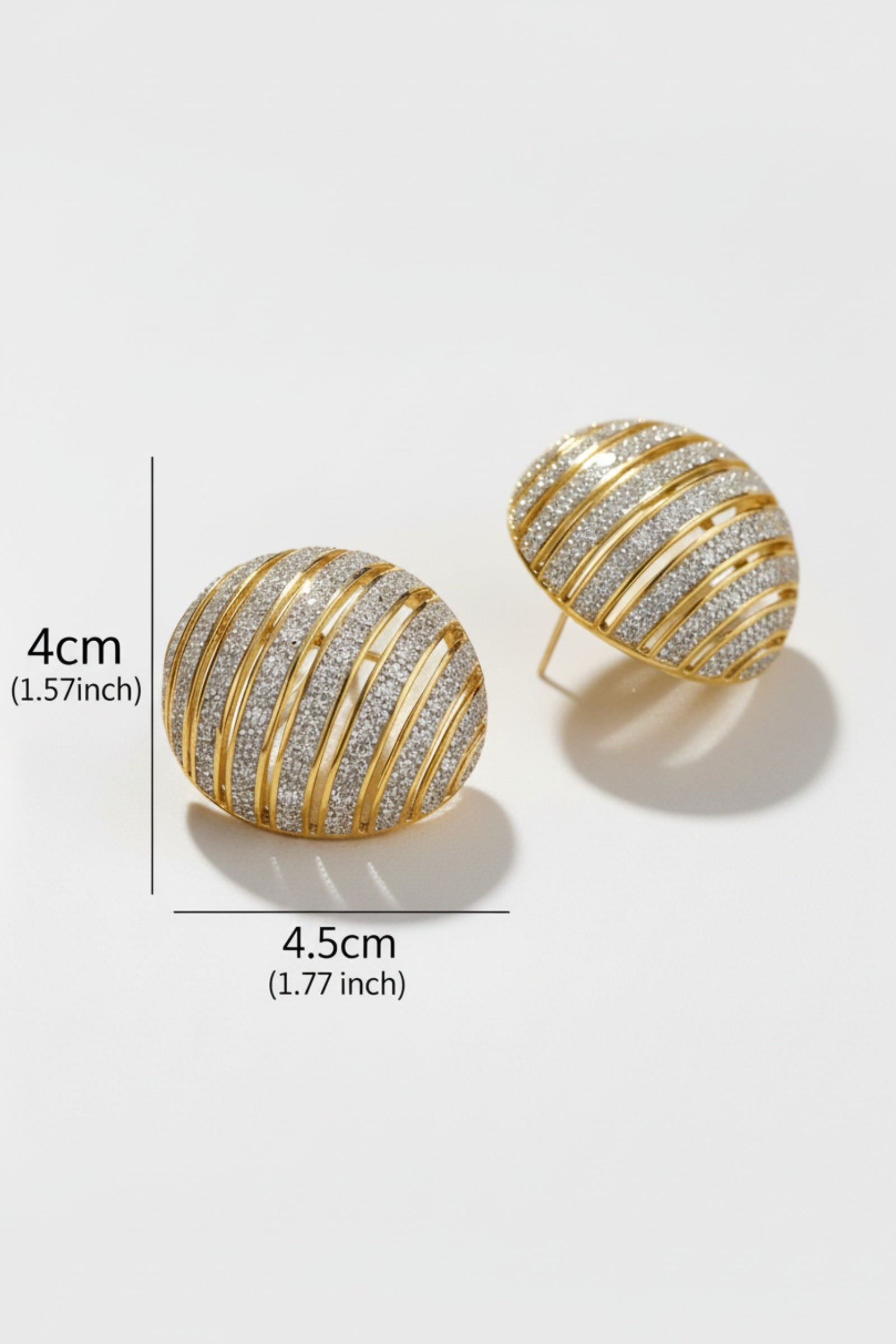 Size drawing of chunky ribbed two-tone dôme earrings in gold and silver, styled for a mob wife aesthetic with a bold architectural texture.
