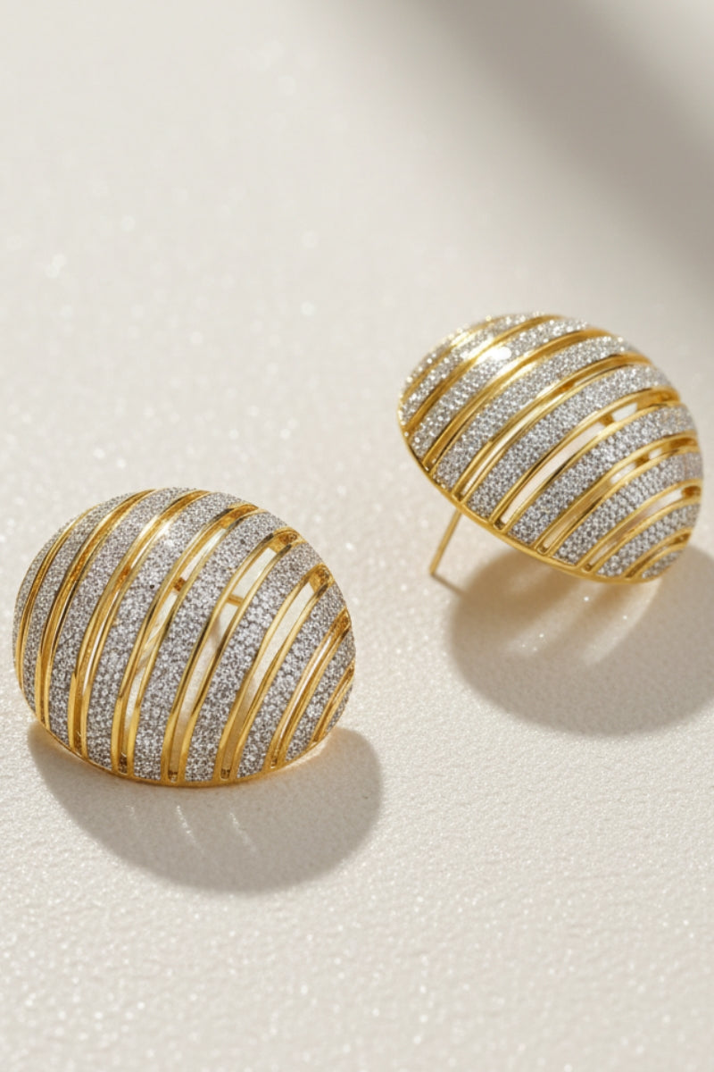 Chunky ribbed two-tone dôme earrings in gold and silver, styled for a mob wife aesthetic with a bold architectural texture.