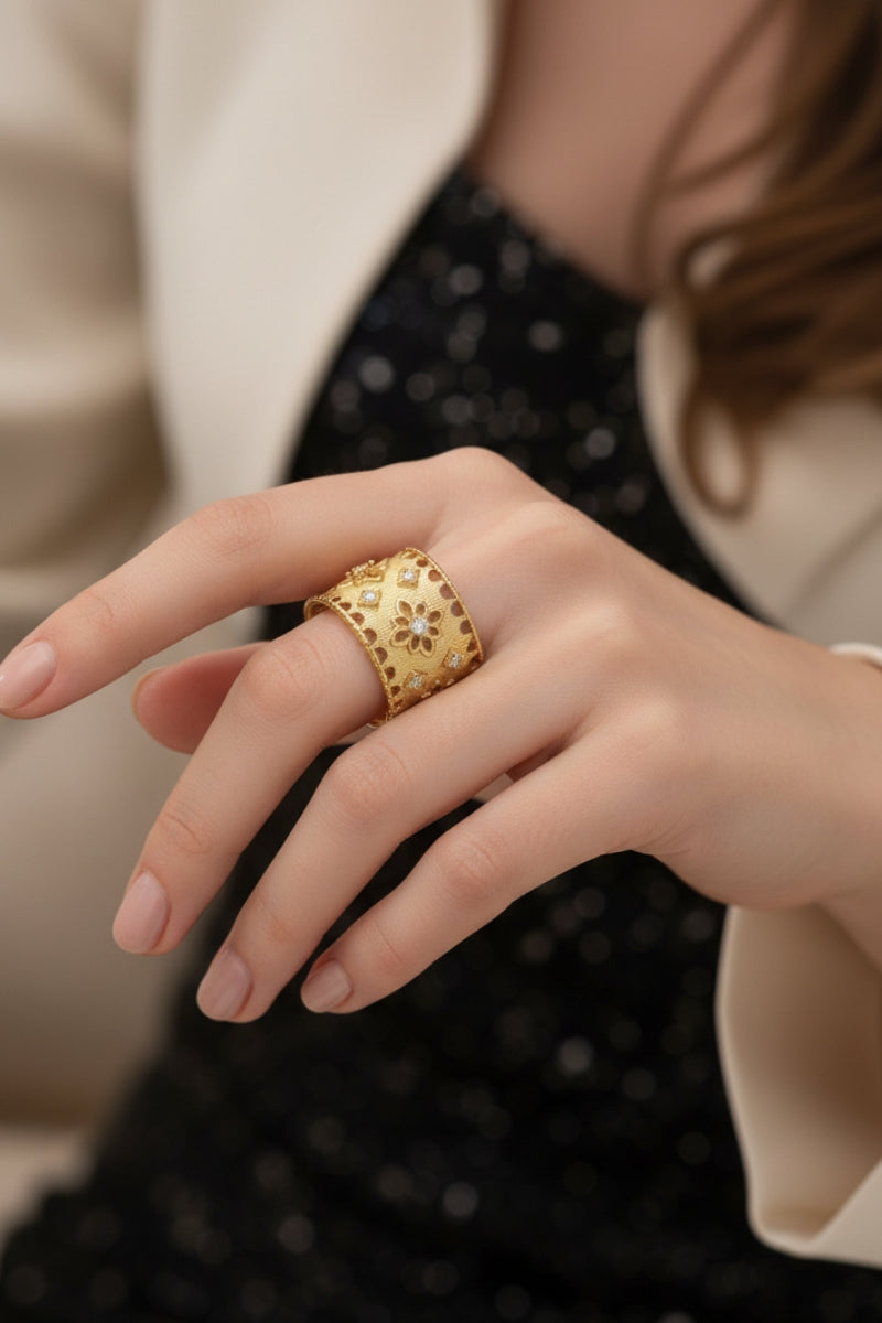 A close-up portrait of a hand with a textured gold ring, layered over a sparkling black dress, ideal for an upscale Chicago evening event or cocktail party.
