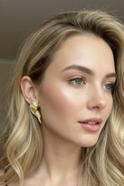 Aurelia sunburst pleated gold earrings for bridal jewelry styling in London boutique.