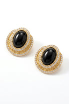 Pair of black czech crystal halo stud earrings on a white background