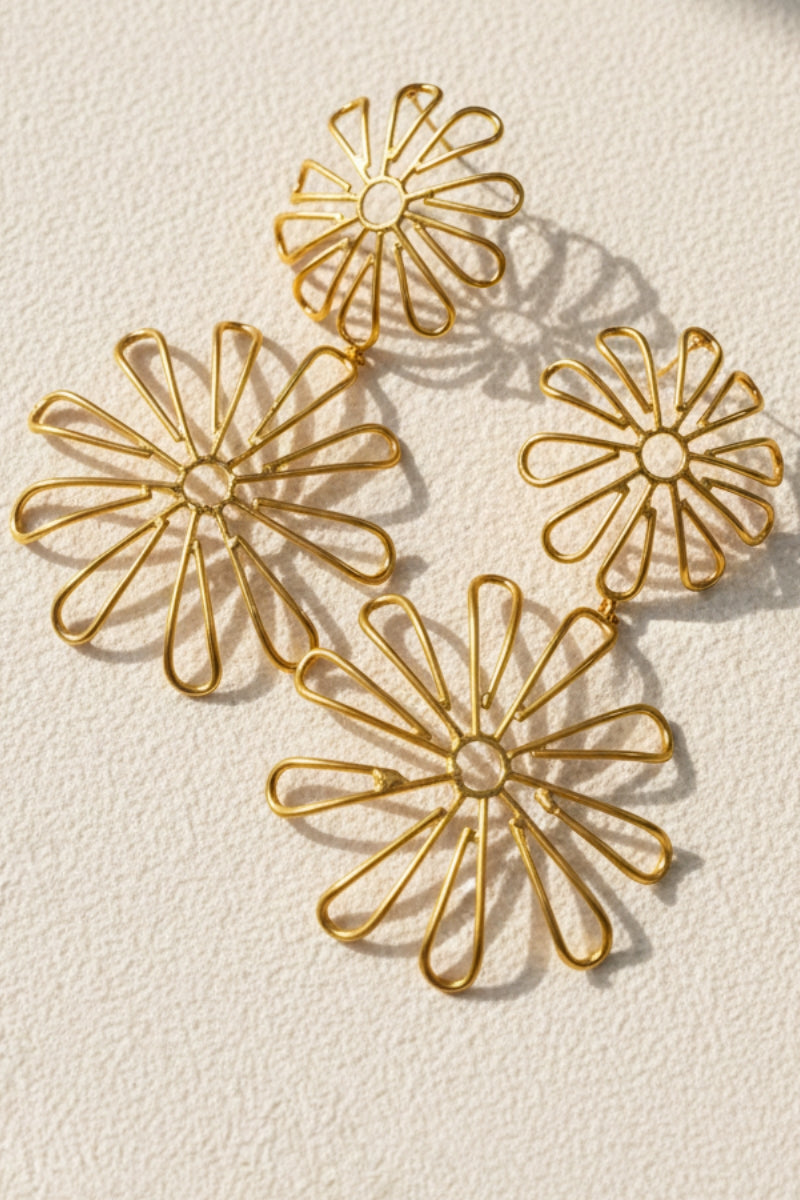 Flora double daisy flower drop earrings in gold with an intricate cutout design for a boho-chic botanical look.