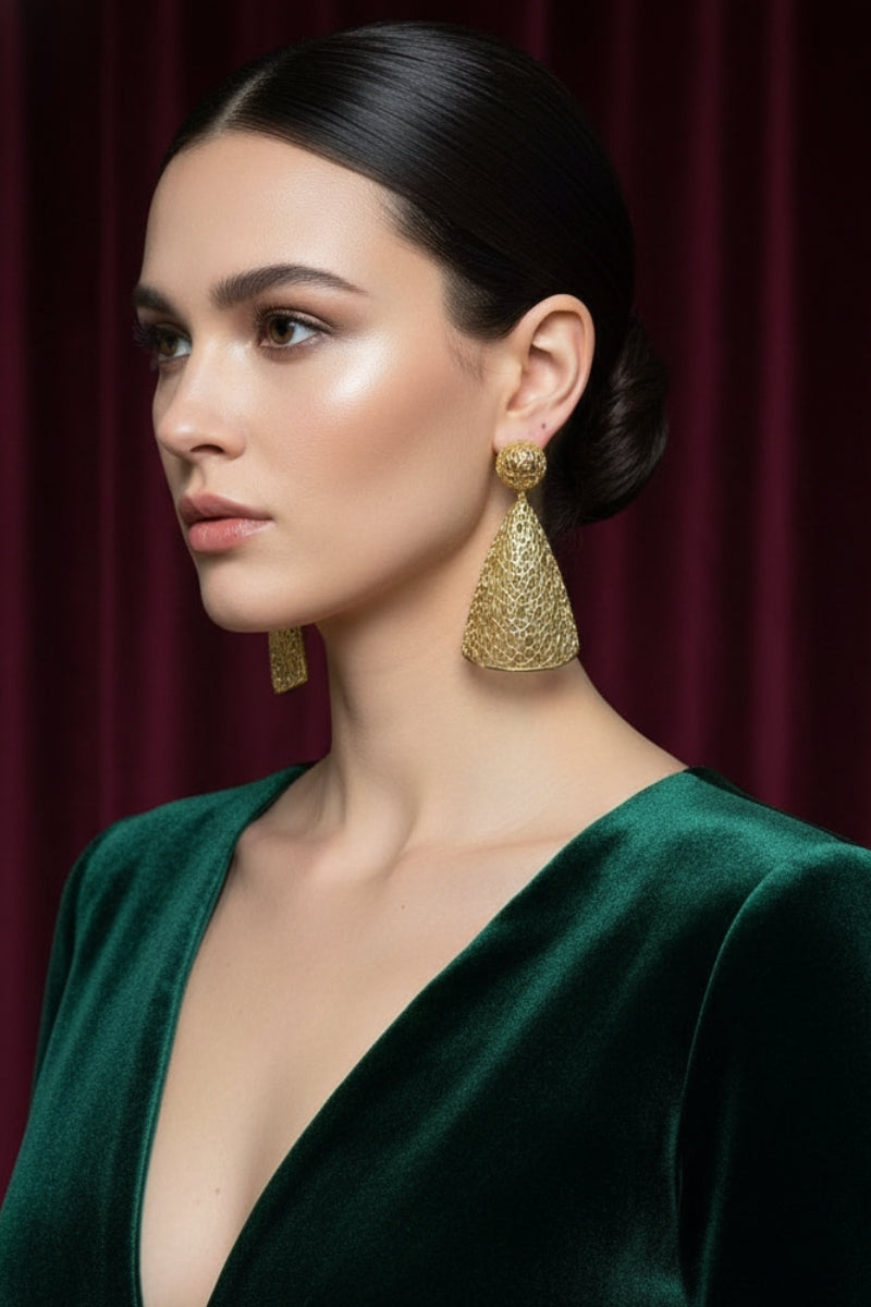 Elegant model wearing 18K gold plated honeycomb dangles with a dark green velvet V-neck dress for a formal holiday party.
