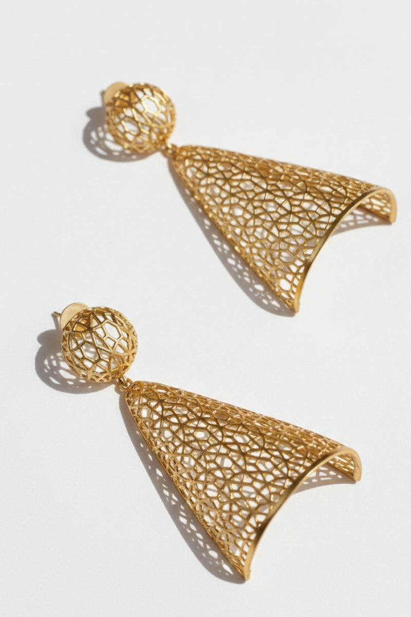 Two 18K gold plated lattice drop earrings on a light gray surface, with ball posts and cone-shaped dangles.