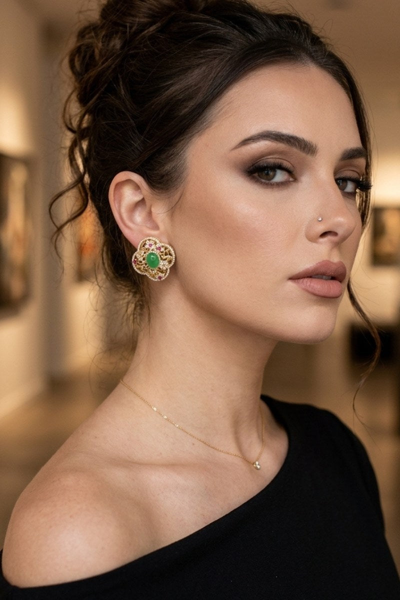 Model wearing green crystal quatrefoil stud earrings, view 3