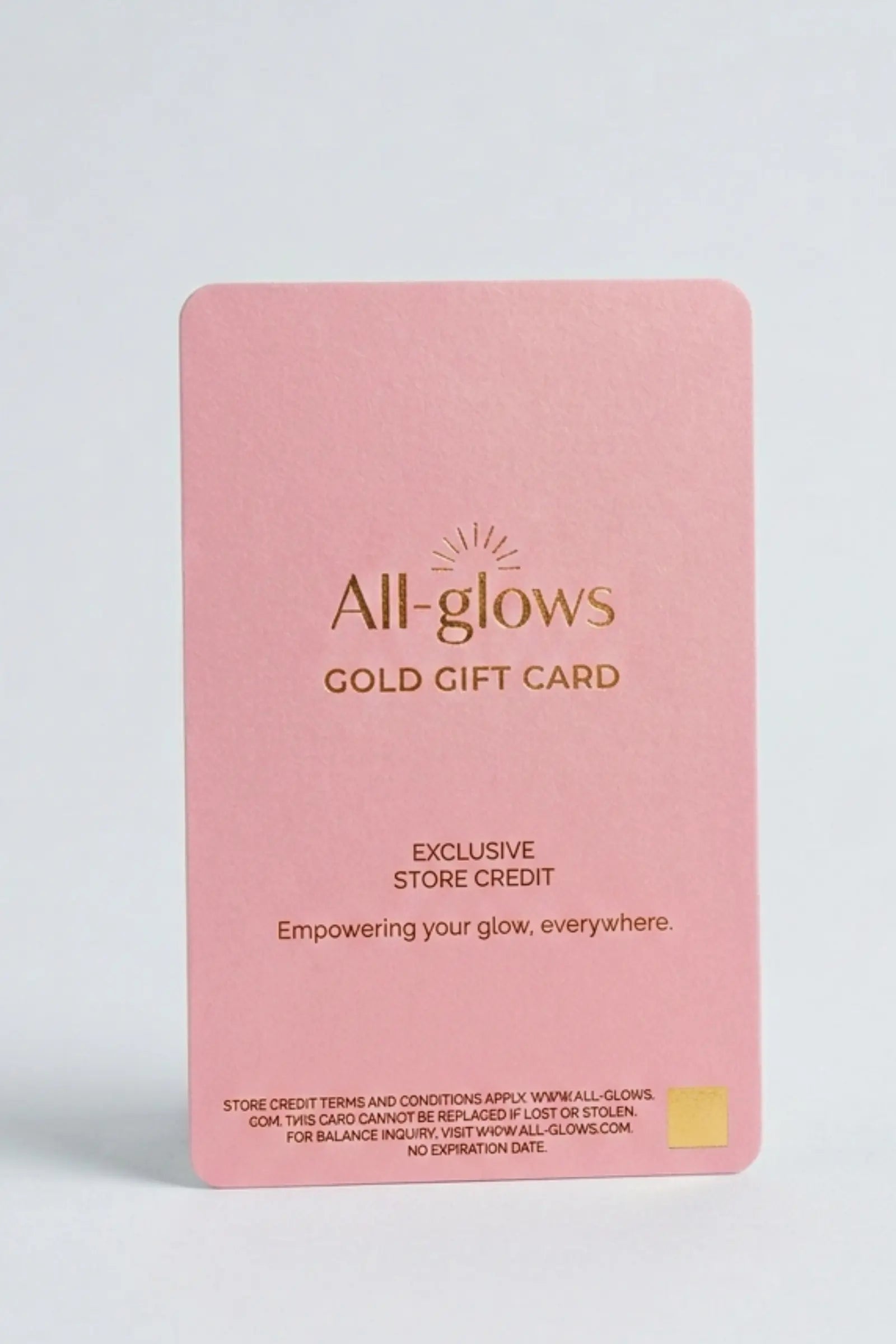All-glows brand minimalist pink fashion jewelry gift card with gold foil logo, clean white background with soft natural shadows, aesthetic premium store credit voucher for her.