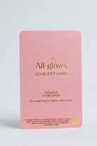 All-glows brand minimalist pink fashion jewelry gift card with gold foil logo, clean white background with soft natural shadows, aesthetic premium store credit voucher for her.