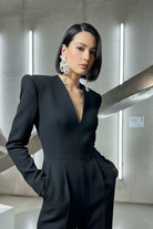 Model wearing fluid pearl drops with a silk top, capturing the casual luxury vibe of Miami's fashion scene.