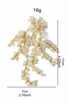 Product detail shot showing dimensions of 18K gold shell pearl earrings for transparency in online shopping.