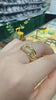  18K gold-plated Jasmine ring on a finger, rotating to reveal its unique interlocking Cuban chain knot design. The ring features a stunning contrast between a high-shine smooth gold surface and a brilliant micro-pave crystal setting that sparklingly catches the light. This video answers how to choose a tarnish-resistant statement ring for everyday luxury, providing aesthetic style inspiration for standard office wear, street chic layers, and timeless minimalist capsule wardrobes.