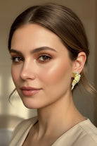 Art Deco inspired gold pleated earrings as a premium anniversary jewelry gift in Los Angeles.