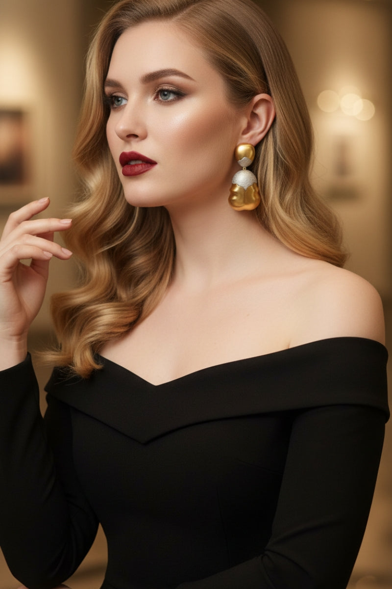 Sophisticated woman with red lipstick wearing oversized two-tone frosted gold earrings, showcasing bold bridal or party jewelry.