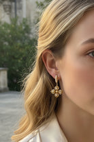 All Glows Opulence earrings featuring a high-luster large round shell pearl cradled in a sculptural 18K gold-plated molten setting.