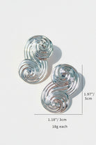Product dimensions for Seraphina Sculptural Swirl Earrings: height 5cm (1.97"), width 3cm (1.18"), and weight 18g each. Large silver-tone swirl statement earrings specifications.