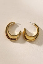 Side detail of triple-ribbed wave hoop earrings showing the earring profile and posts