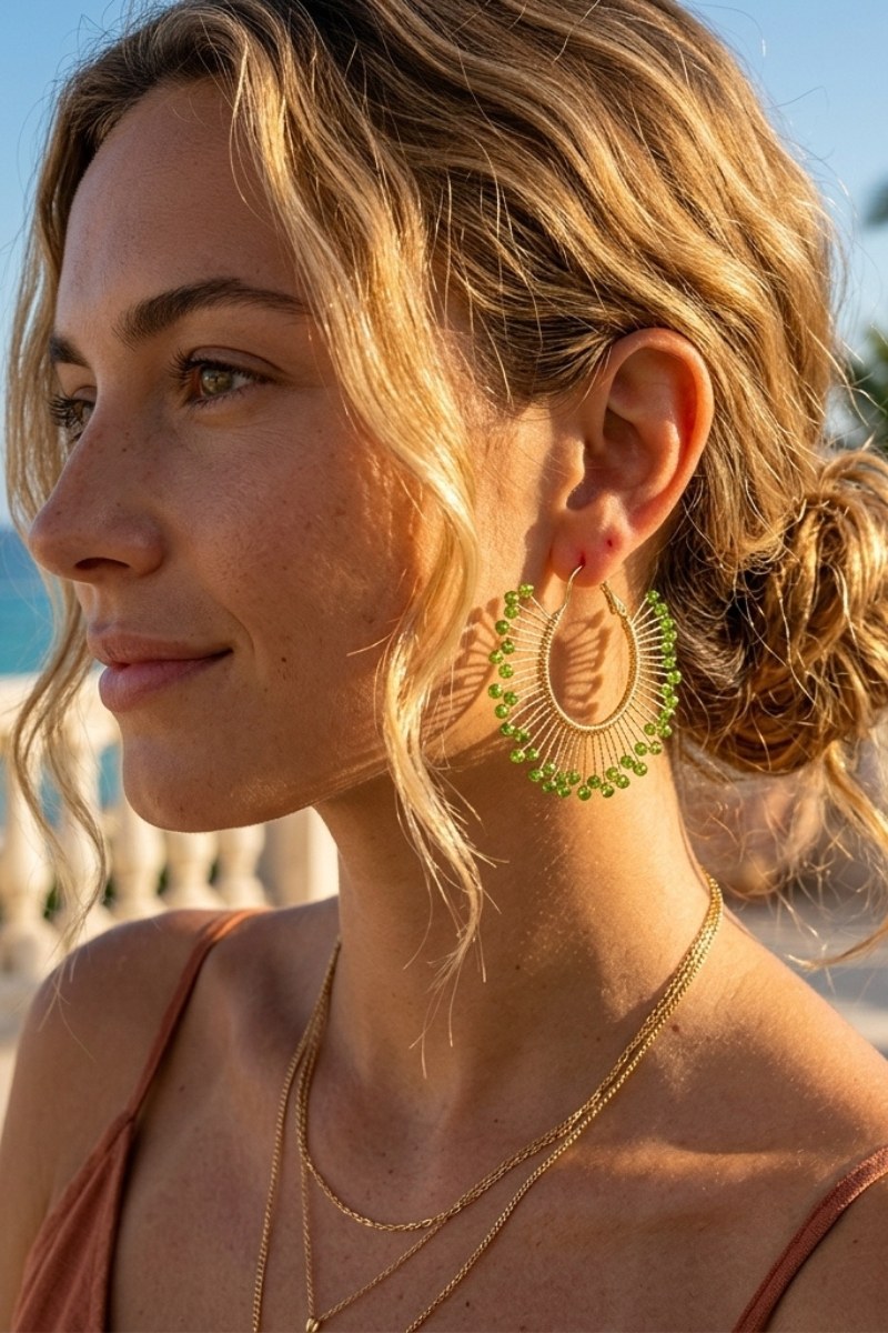 Model wearing solburst wire-wrapped beaded sunburst hoop earrings in the Olive variant, view 2