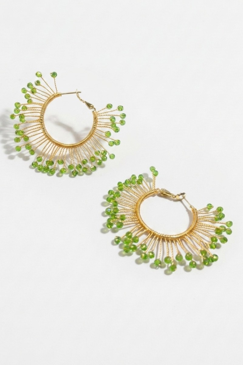 Pair of solburst wire-wrapped beaded sunburst hoop earrings in the Olive variant on a white background