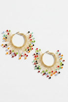 Pair of solburst wire-wrapped beaded sunburst hoop earrings in the Prism variant on a white background